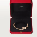 Cartier / JUSTE UN CLOU BRACELET Juste un Clou bracelet, classic, 18K rose gold (750/1000), set with 32 brilliant-cut diamonds totaling 0.58 carat. Width: 3.5 mm (for size 17). - Image 12