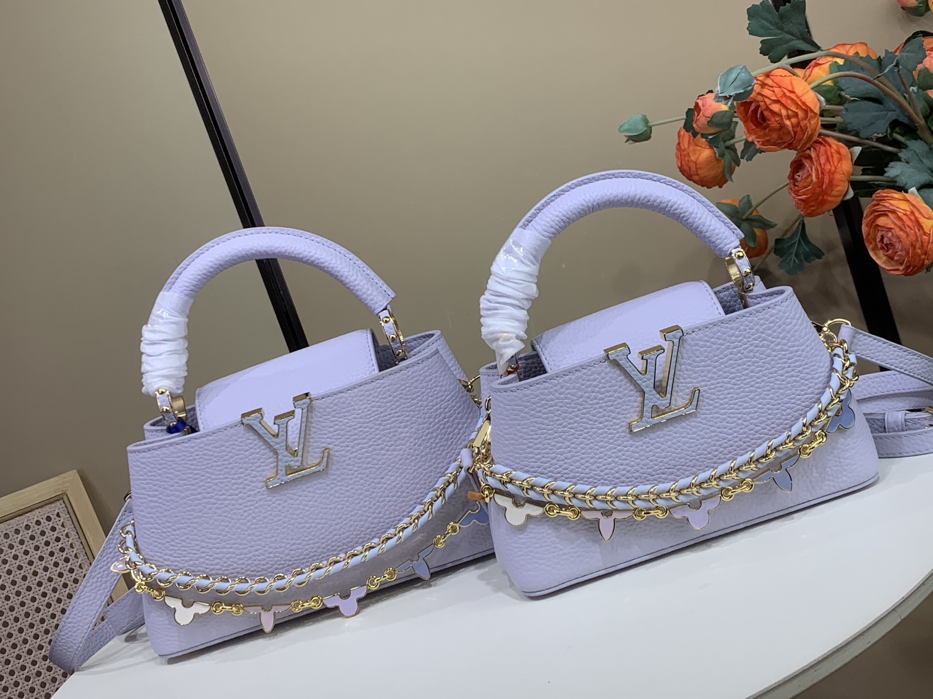 1789641300592 CAPUCINES EAST-WEST BB Handbag M2A379, Purple / Enamel (Macaron) - Image 1