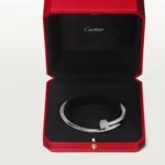 Cartier / JUSTE UN CLOU BRACELET Juste un Clou bracelet, classic, 18K white gold (750/1000), set with 32 brilliant-cut diamonds totaling 0.58 carat. Width: 3.5 mm (for size 17). - Image 11