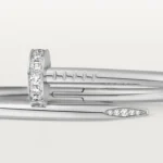 Cartier / JUSTE UN CLOU BRACELET Juste un Clou bracelet, classic, 18K white gold (750/1000), set with 32 brilliant-cut diamonds totaling 0.58 carat. Width: 3.5 mm (for size 17). - Image 8