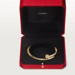 Cartier / JUSTE UN CLOU BRACELET Juste un Clou bracelet, classic, 18K yellow gold (750/1000), set with 32 brilliant-cut diamonds totaling 0.58 carat. Width: 3.5 mm (for size 17). - Image 10