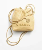 CHANEL / CHANEL 22 MINI HANDBAG Shiny Calfskin & Gold-Tone Metal Yellow Ref.  AS3980 B08037 NQ387