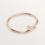Cartier / JUSTE UN CLOU BRACELET Juste un Clou bracelet, classic, 18K rose gold (750/1000), set with 32 brilliant-cut diamonds totaling 0.58 carat. Width: 3.5 mm (for size 17).